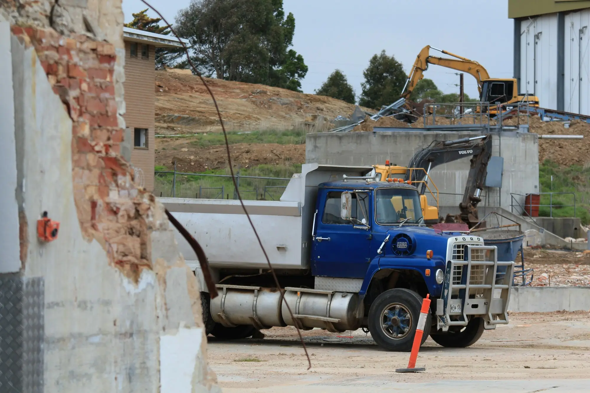 Tipper truck and excavator on a worksite in Littlehampton, South Australia